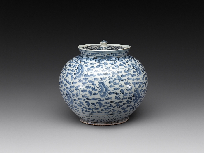 Whilte Porcelain Jar with Scroll Design and Inscription of 